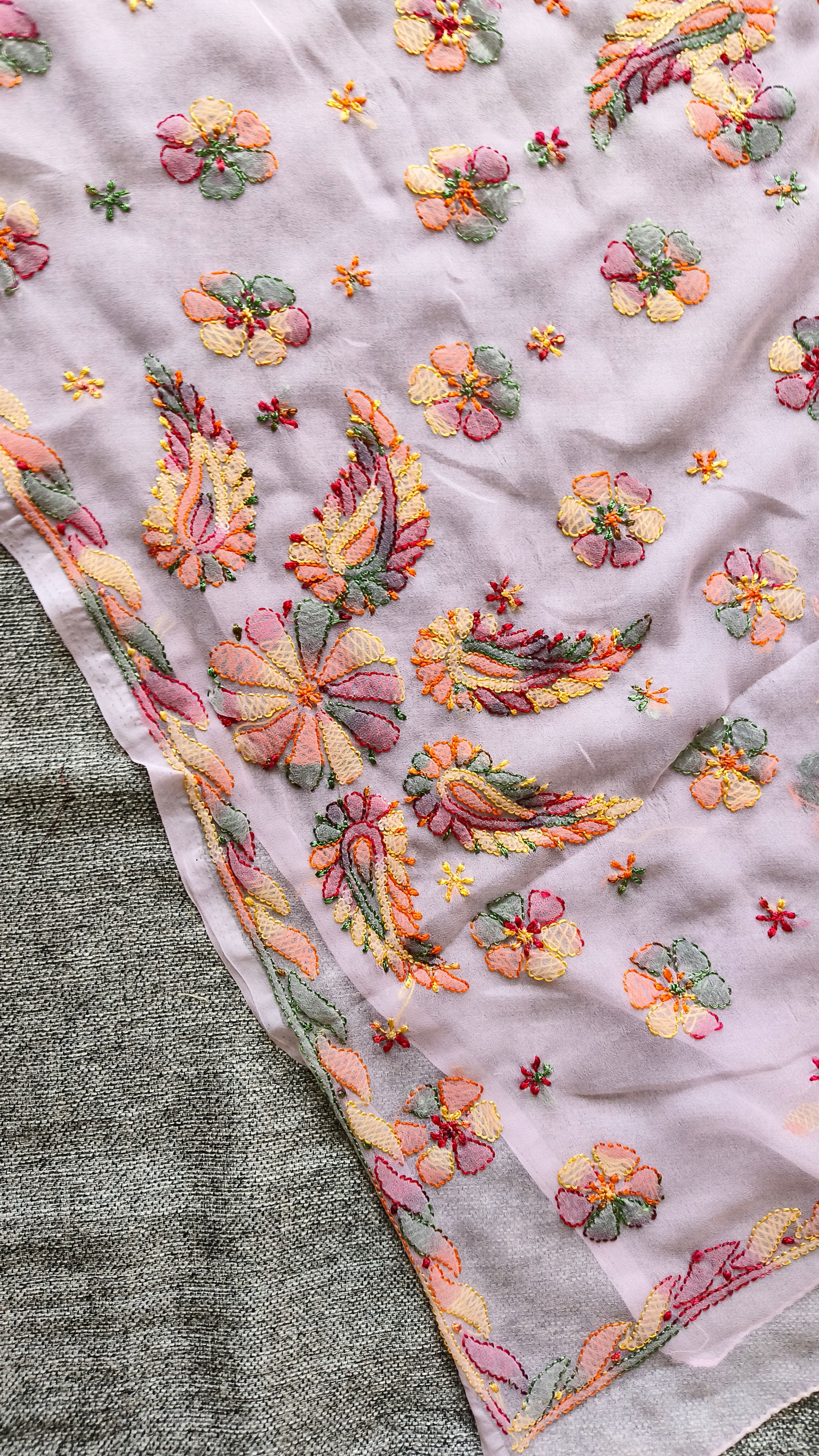Pastel georgette Chikankari saree with multicolour embroidery, buta motifs and embroidered pallu