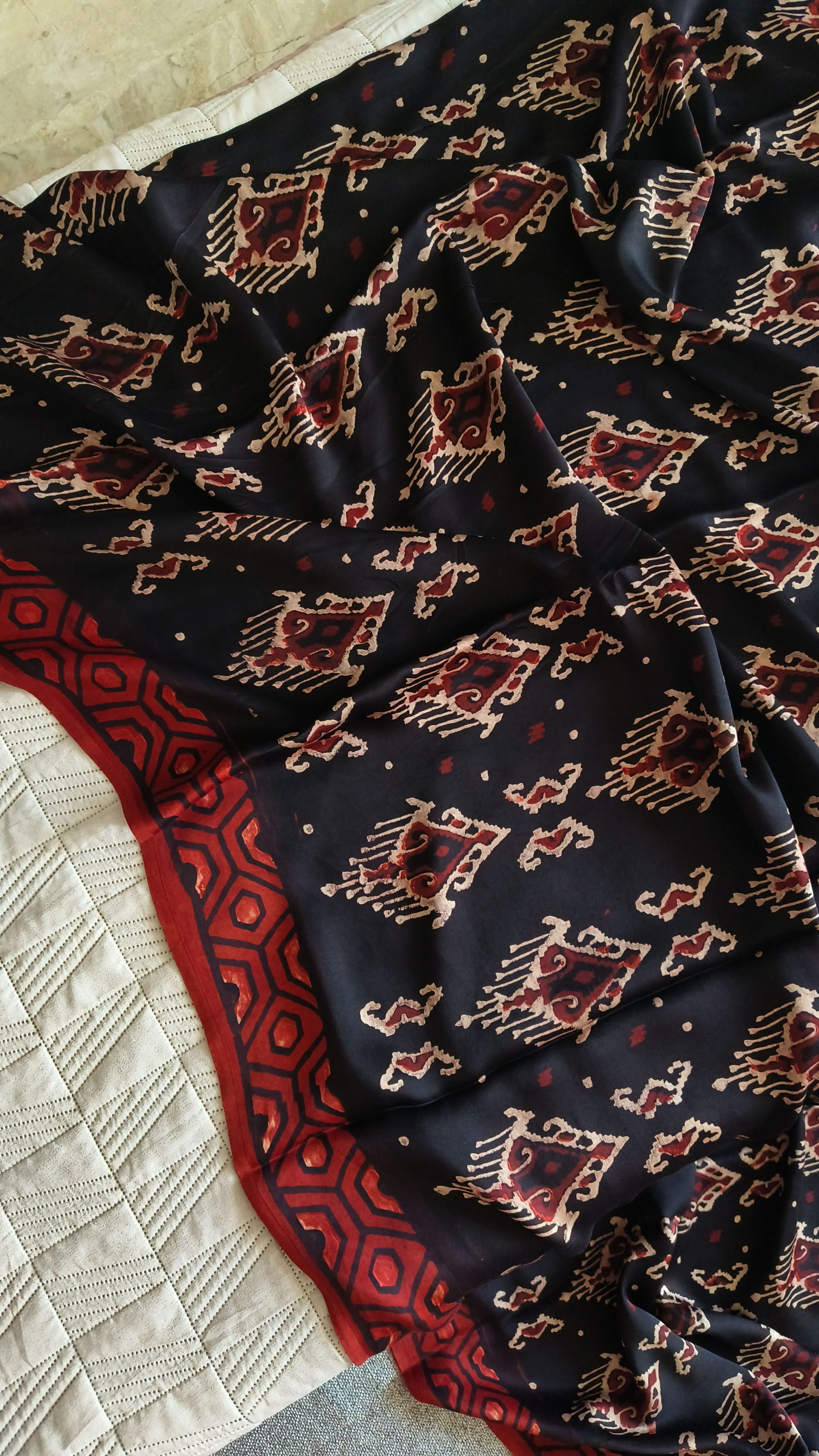 Border detail of black Ajrakh modal silk saree with Ikkat block pattern