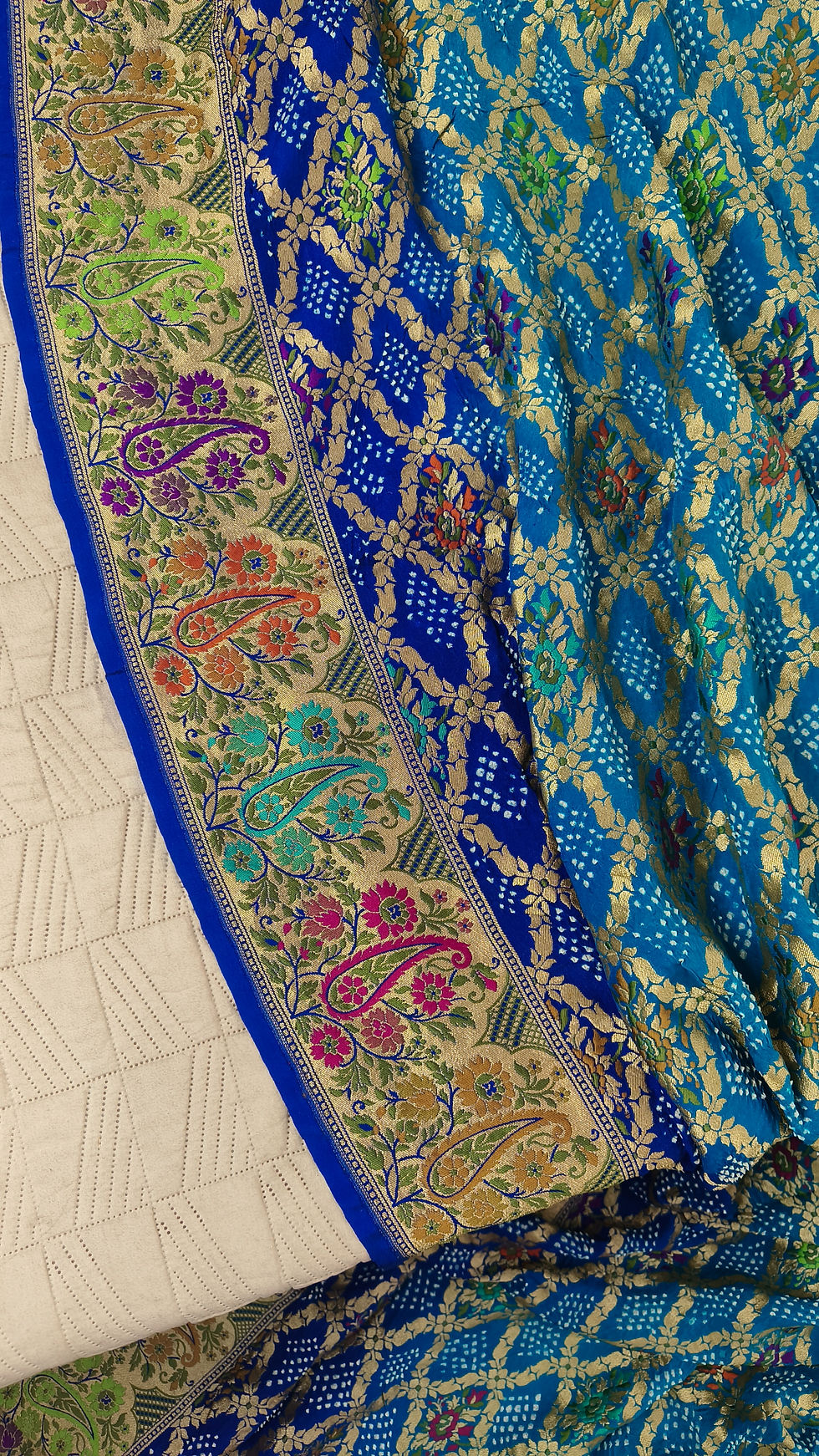 Dark blue Banarasi border with Rai Bandhani and Meena detailing on georgette saree