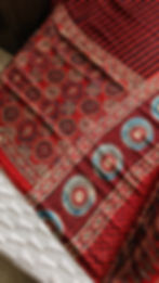ajrakh modal silk saree with antique zari nakshi pallu. red saree.