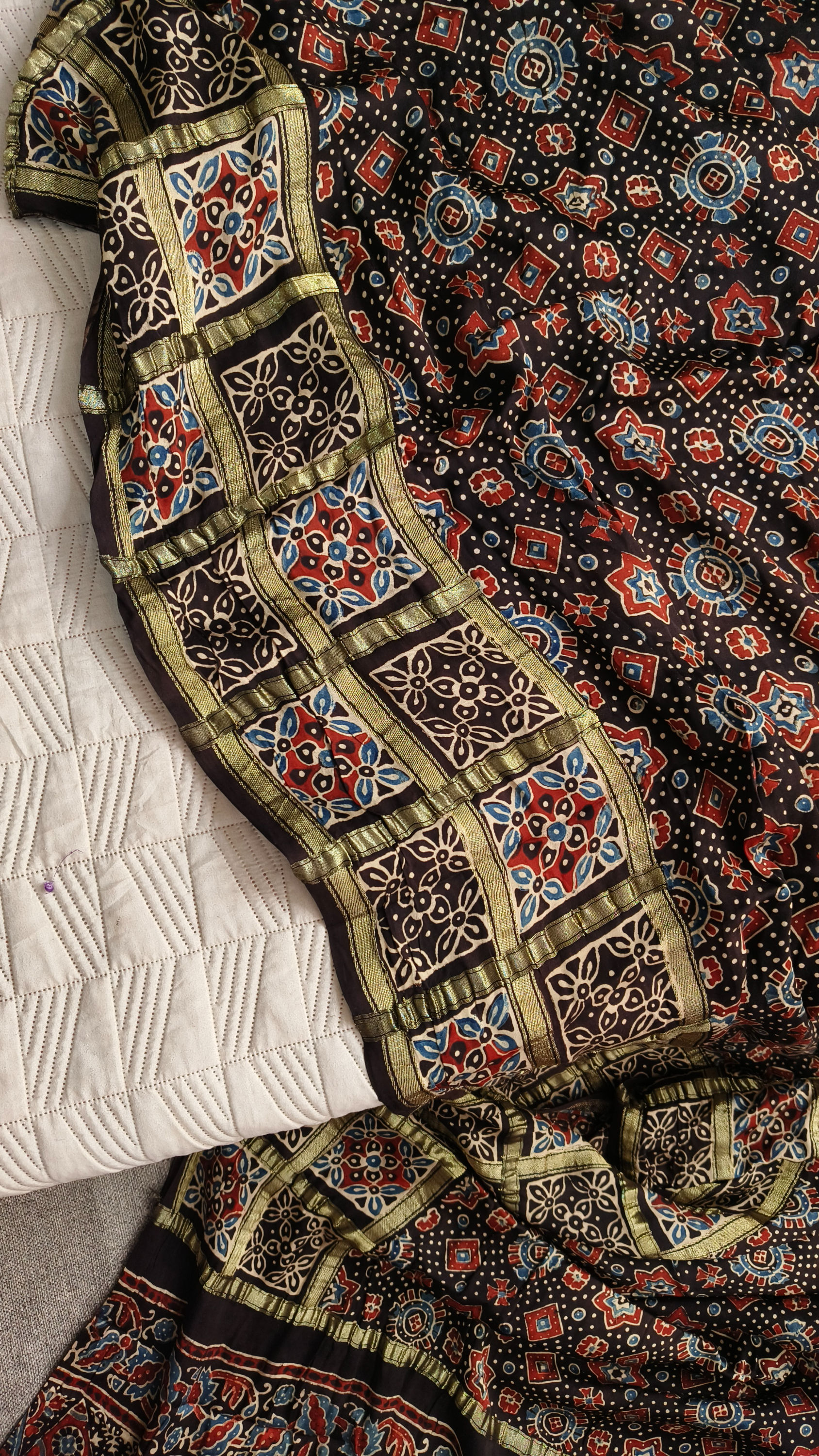 Gharchola-inspired zari border on Ajrakh modal silk saree