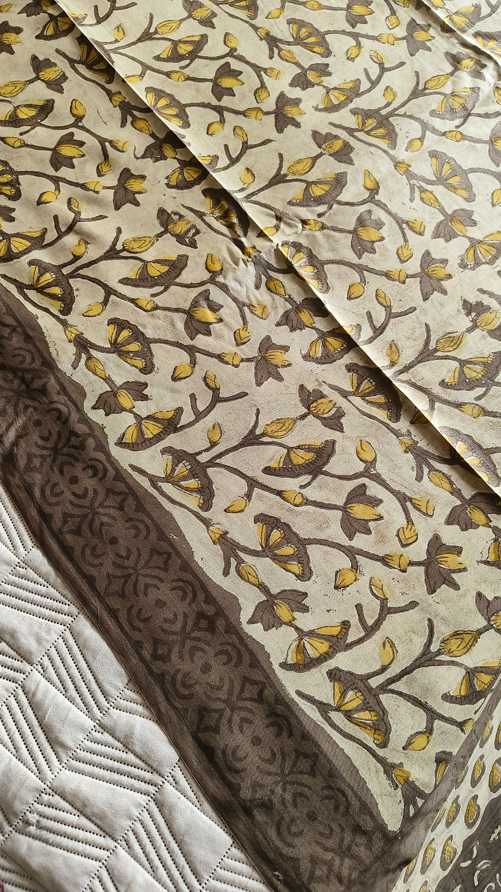 Close-up of Vanaspati handblock cream garden motifs on lightweight modal silk saree