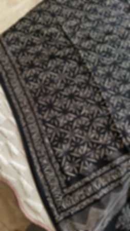 Close-up of Vanaspati handblock black & white motifs on lightweight modal silk saree