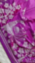 Close-up of traditional Kantha hand embroidery on the saree border