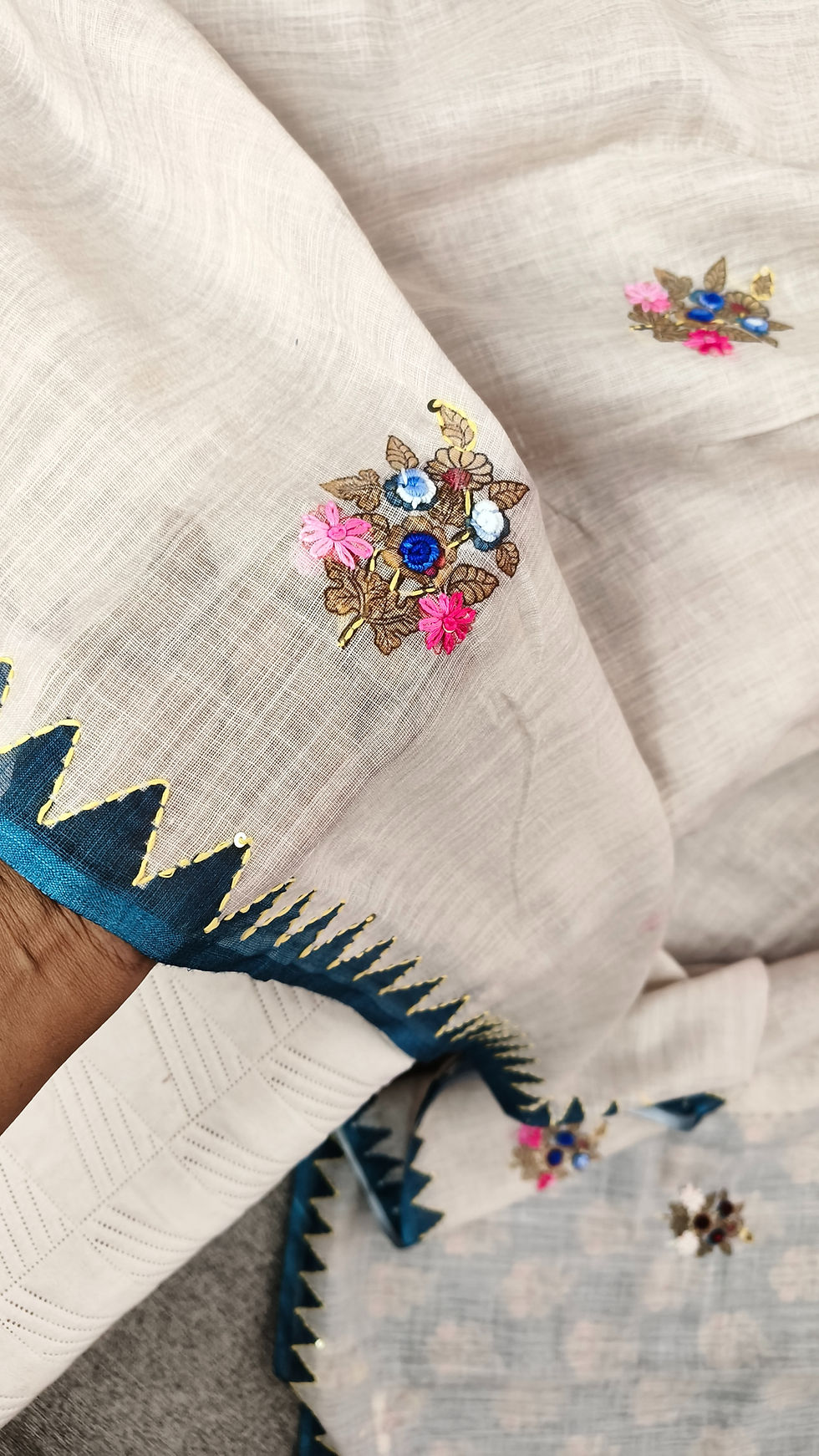 Thumbnail: Hand embroidery detail on cotton linen saree body