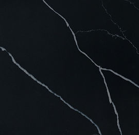 Close-up of Marquina Midnight quartz showing bold white veining on black surface