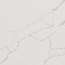 Close-up of New Calacatta Laza quartz showing refined brown and gray veining