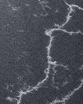Basalto quartz countertop close-up, deep even volcanic grey surface, Toronto