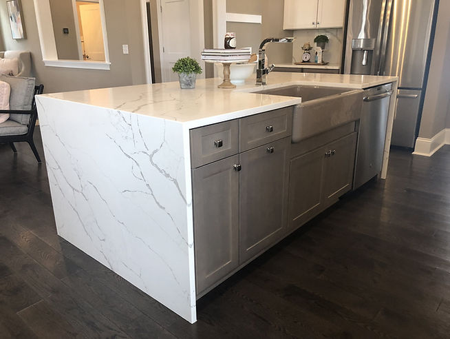 White quartz countertop with waterfall edge on kitchen island in a Toronto home