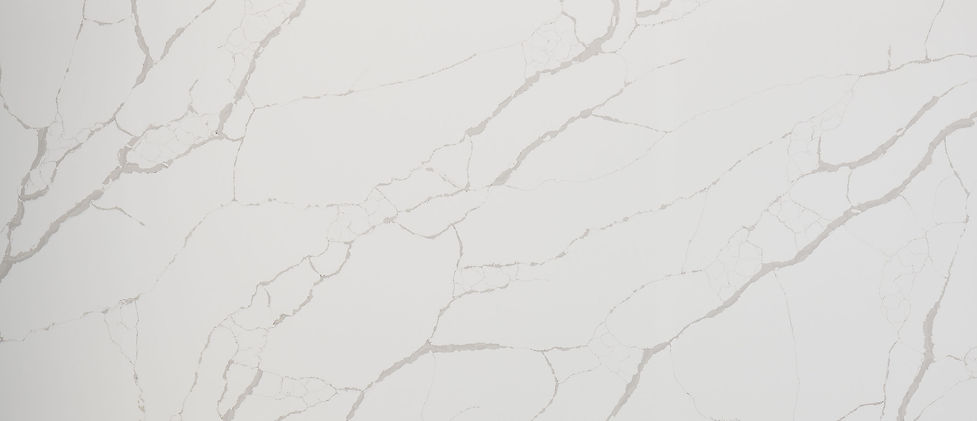 New Calacatta Laza quartz slab with refined brown and gray veining on warm white background