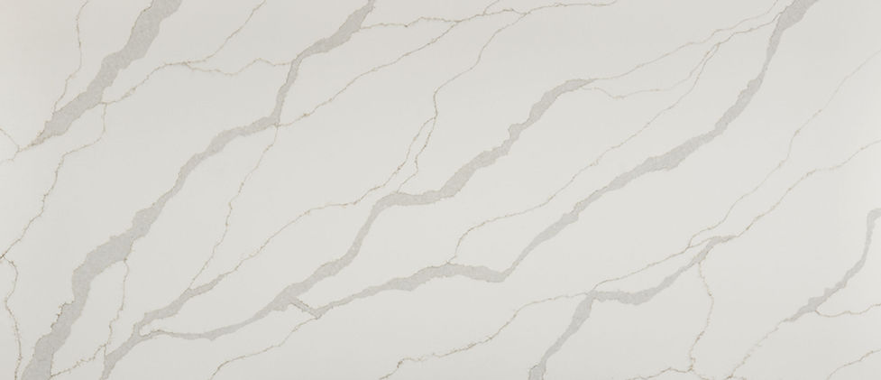 Calacatta Idillio quartz slab with painterly veining in soft gray and beige on warm white
