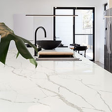 Calacatta Laza quartz countertop on modern kitchen waterfall island