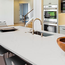 Calacatta Alto quartz countertop on contemporary waterfall island