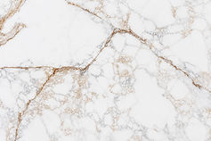 Calacatta Rame quartz countertop close-up, bold copper and gold veining on white, Toronto