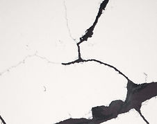 Notte Viola quartz countertop close-up, deep black with soft violet undertones, Toronto