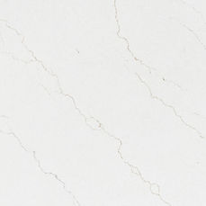 Close-up of Calacatta Adonia quartz showing flowing gray and gold veining detail