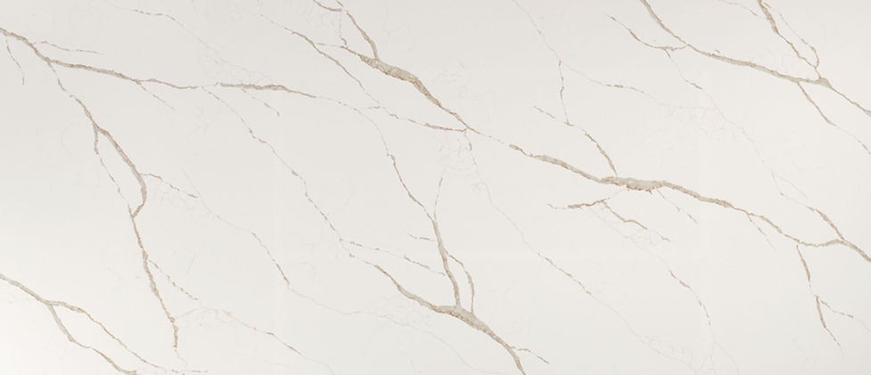 Calacatta Laza Oro quartz slab with bold veining and warm gold tones on warm white