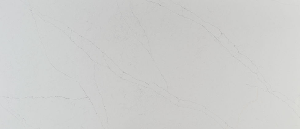 Calacatta Alto quartz slab with bold, sweeping gray veining on warm white background
