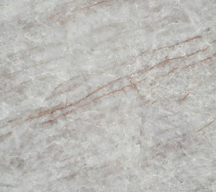 Taj Mahal Royale quartz countertop close-up, flowing rust and gold veining on light ivory-grey, Toronto