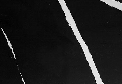 Rocco black quartz slab with bold white veining from Stone Wizards Select