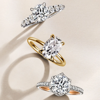 Three diamond rings close up on a cream background. Doves by Doron Paloma Equestrian Collection
