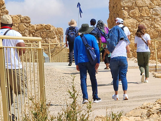Doron Jamchi tour guide, guiding a group in Masada
