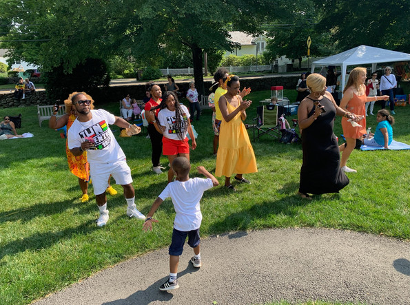 Attendees of our 2023 Juneteenth event dance to music from The Misfits
