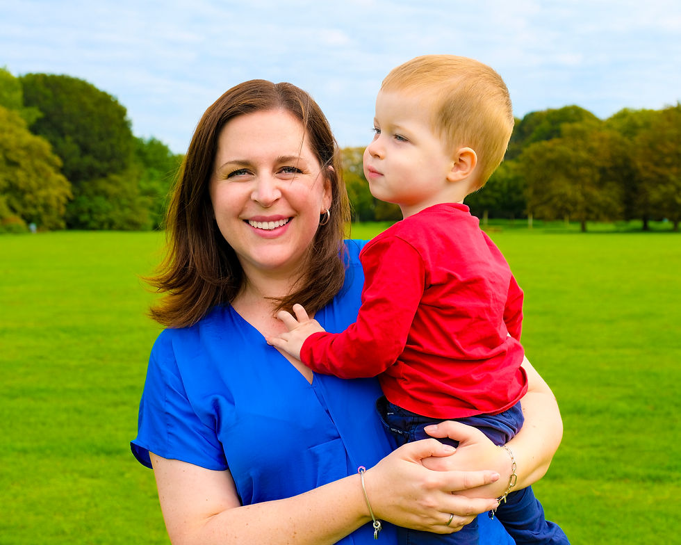 Anna holding her son Matias, smiling to the camera