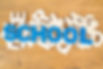 the-word-school-laid-out-of-blue-wooden-letters-on-pile-of-different-letters-lying-on-an-o