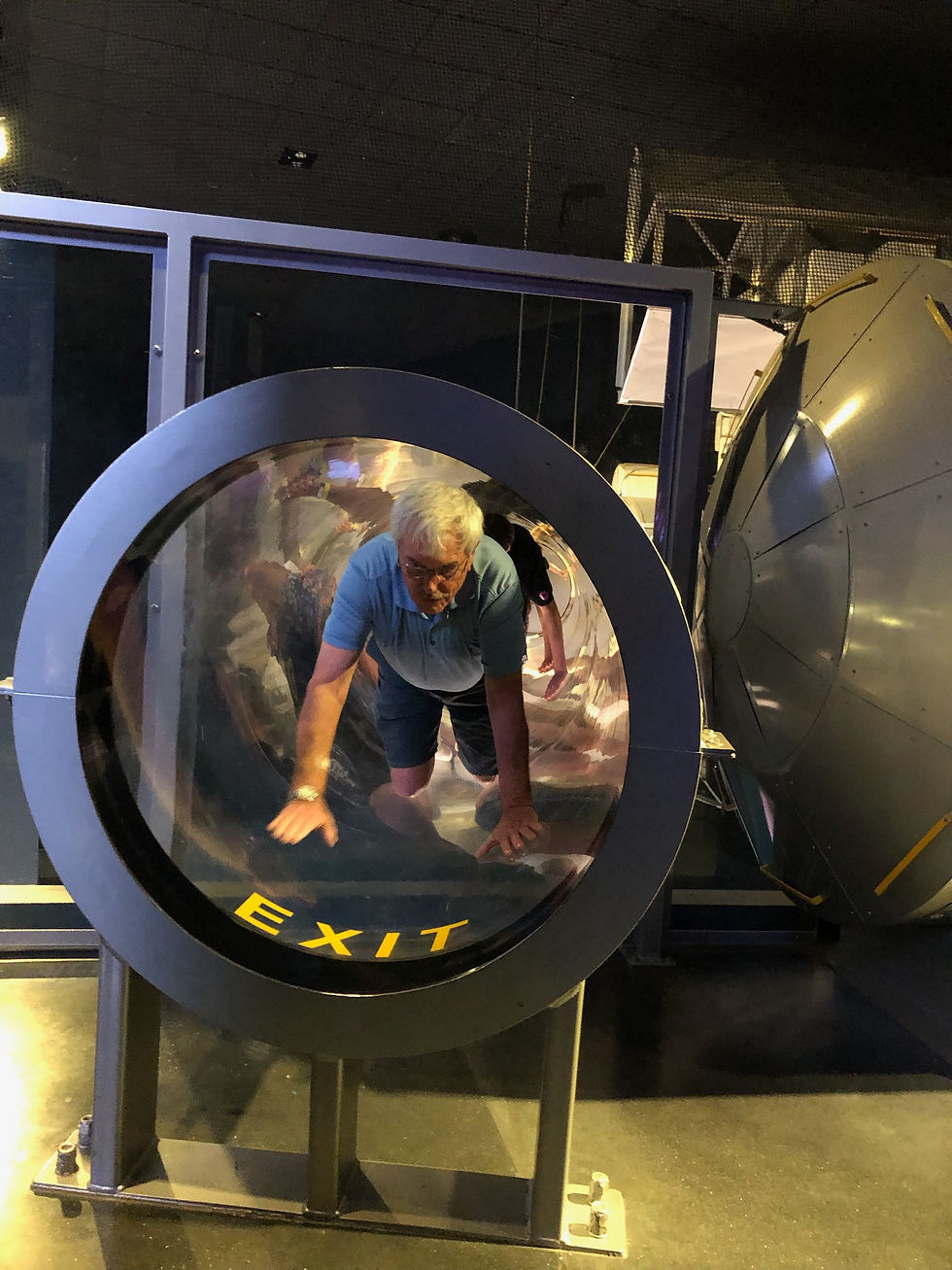 Matt crawling through a spaceship adventure