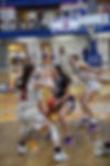 Varsity women's basketball playing in a tournament