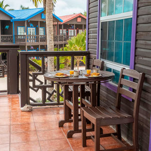 Daily breakfast for two served at X'Tan Ha Resort on Ambergris Caye, Belize — included with the Ambergris Caye Vacation Package, featuring fresh coffee, tea, and juice