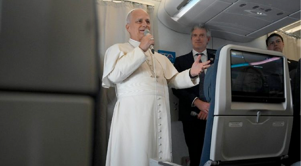 Pope takes questions from journalists
