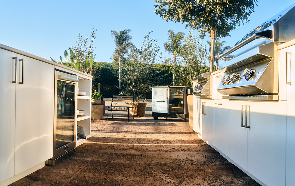 Outdoor kitchen island with a built-in Dometic refrigerator