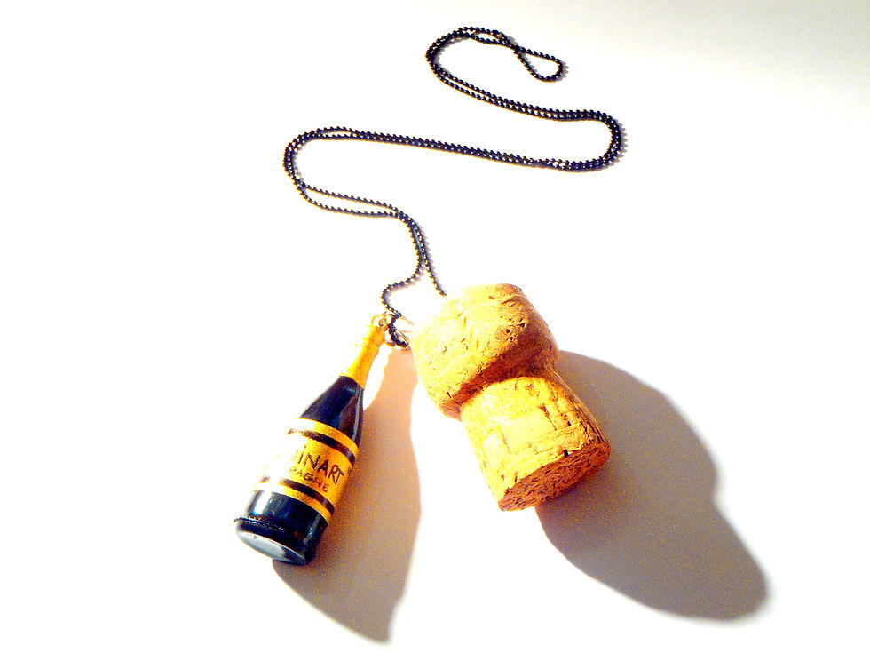 Thumbnail: Collier QU'EST-CE QU'ON FÊTE ?? champagne