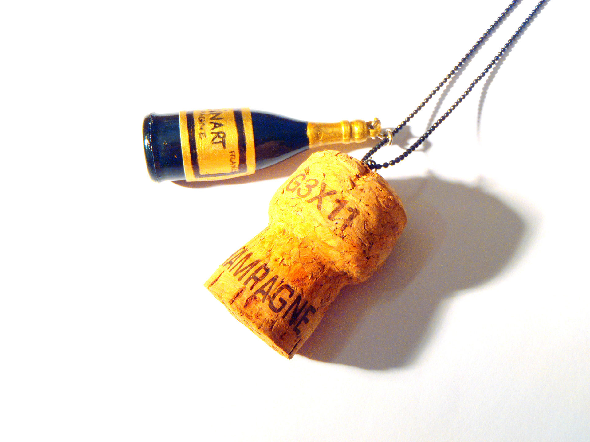 Collier QU'EST-CE QU'ON FÊTE ?? champagne