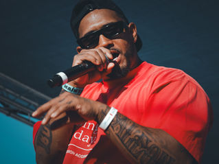 West Coast artist T.F. performing on stage at The Happiness of Pursuit Festival (THOP Fest) in Ontario, California