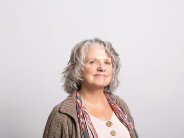 Confident older woman smiling after quitting smoking with mindfulness-based support through the ZenQuit method.