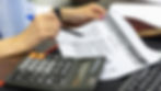 financial analysis with calculator and documents