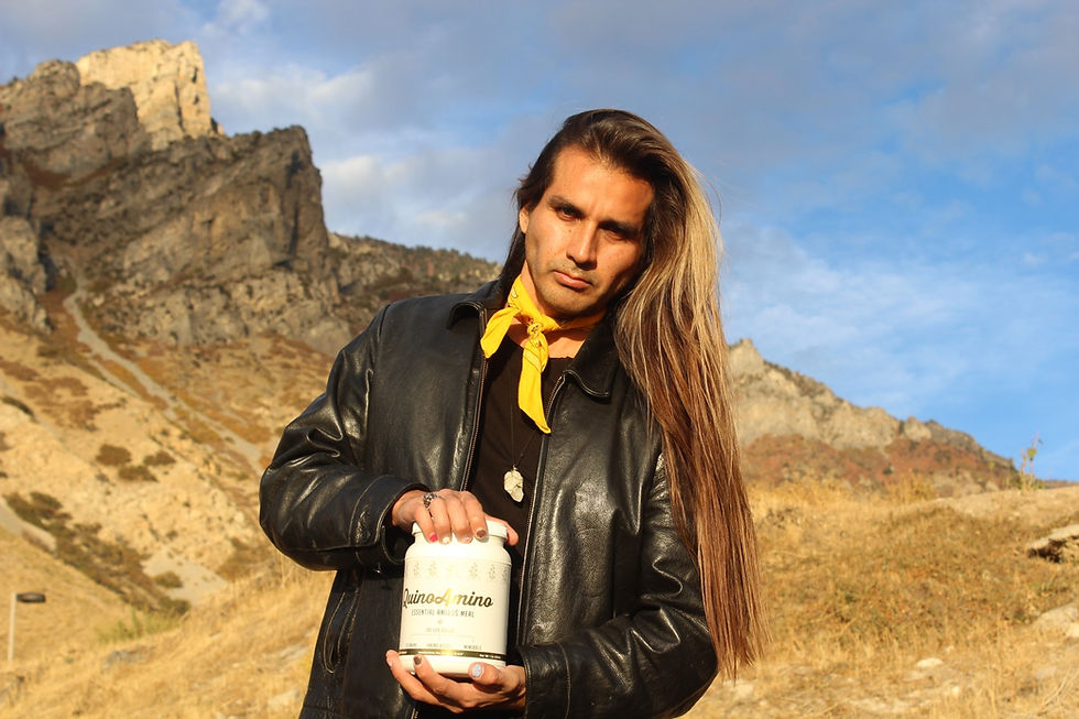 Cesar Valdizan president of Super Seed International holding a QuinoAmino bottle