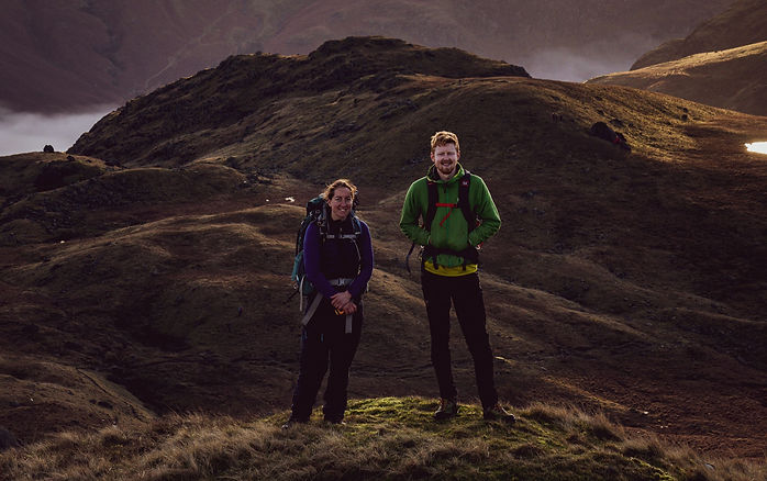 two outdoor leaders in the mountains teaching instructor trainees