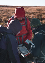 Outdoor instructor training students developing navigational skills during expedition training