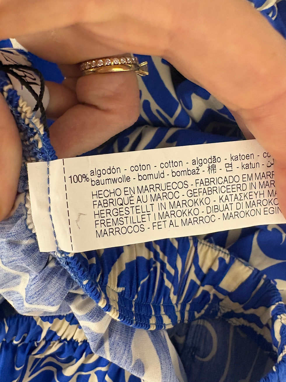 Miniaturbild: White label with text: 100% algodón, cotton, fabricado en Marruecos, etc.