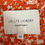 Miniaturbild: LOLLYS LAUNDRY - Copenhagen, XS label on an orange floral blouse detail.