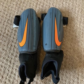 Nike Grey and Orange shin pads