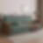 Sofá Cama Paris em veludo cinza com braços marrons, assento retrátil e encosto reclinável, sobre tapete claro em sala moderna — modelo de 2,10 m que vira cama de casal, ideal para espaços compactos e multifuncionais.