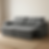 ofá retrátil cinza claro com estofado capitonê e chaise dupla, posicionado sobre tapete bege em sala minimalista com piso de madeira clara.
