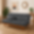 Sofá Cama Caribe em suede cinza com estofado capitonê e base de madeira, posicionado em sala aconchegante com decoração natural — modelo multifuncional que se transforma em cama de solteiro.