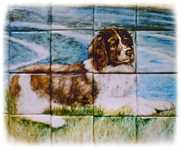 Spaniel dog detail from hand painted mural with Dorset Coast in the background.