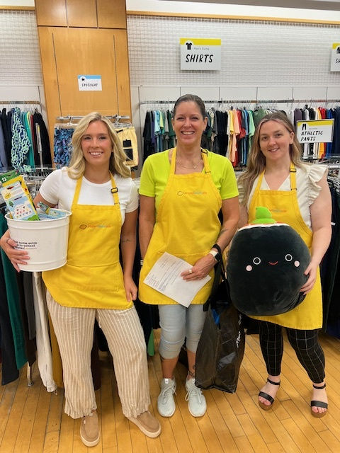 Eye-level view of a community room decorated with colorful posters and tables filled with educational materials